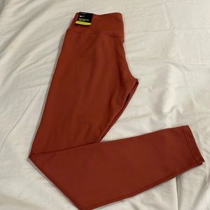 Nike. The Nike One Tight Fit size medium